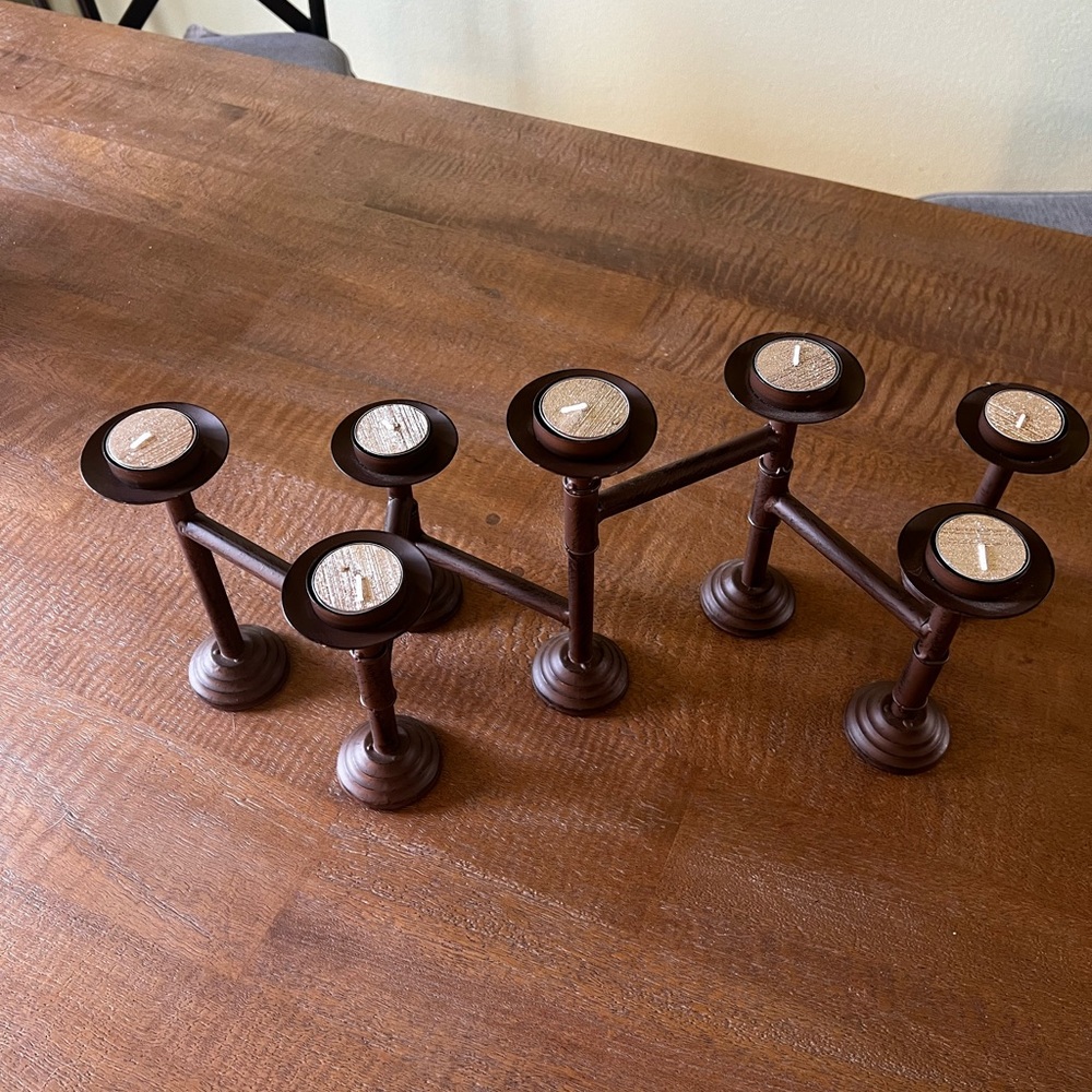 Bronze metal articulated candle holder